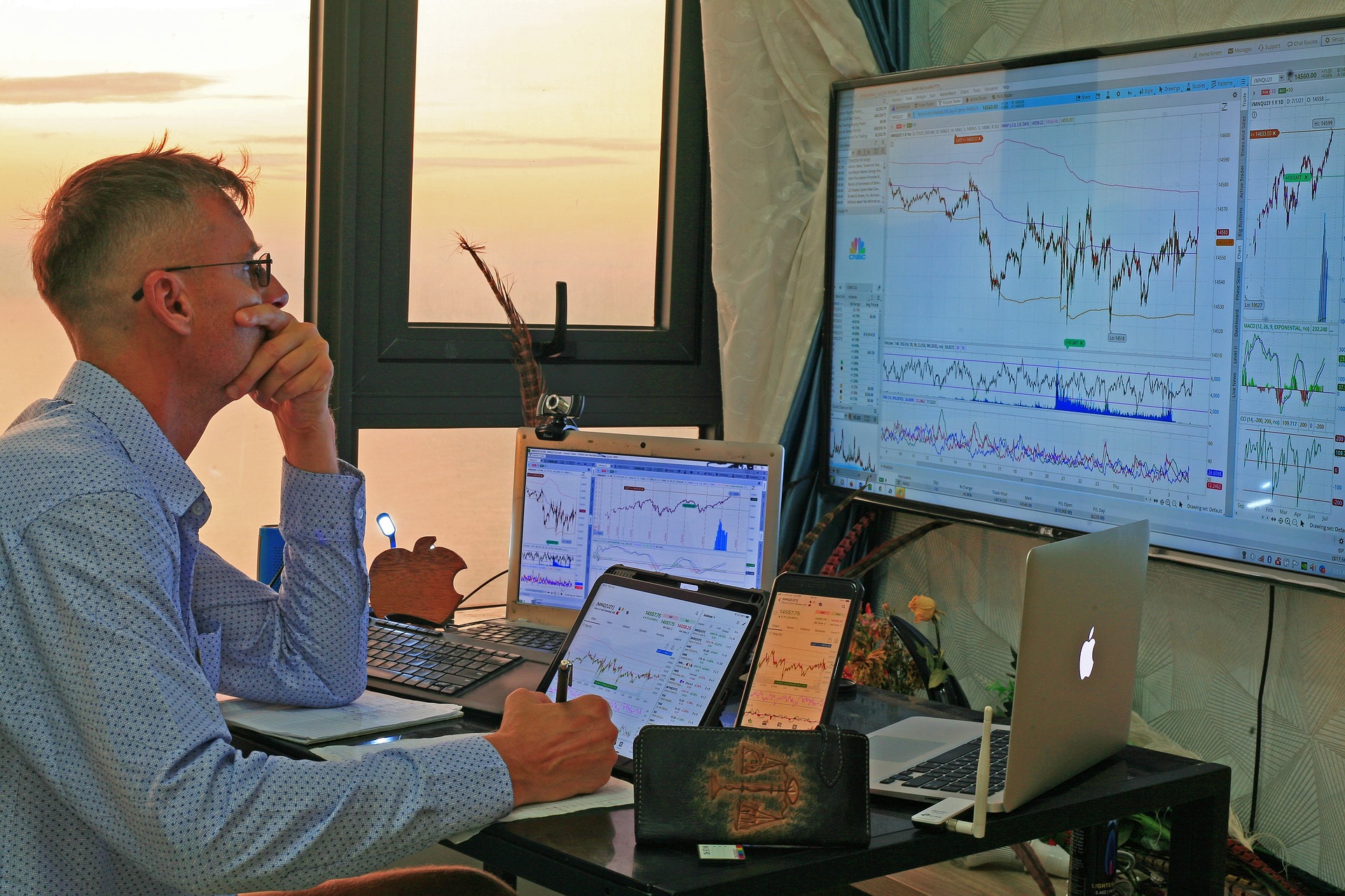 man looking at stocks